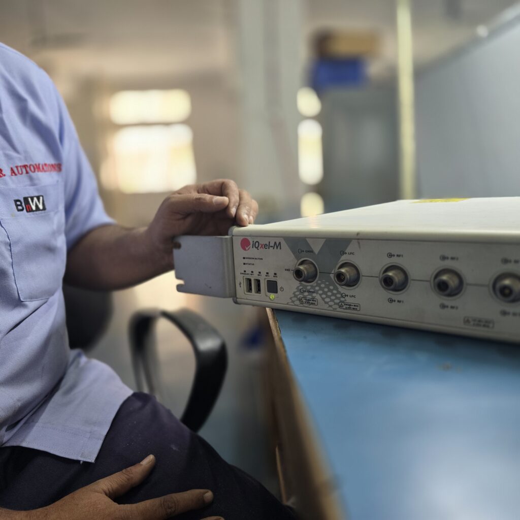 Star Automations engineer testing a wireless device on the LitePoint IQxel-M connectivity tester