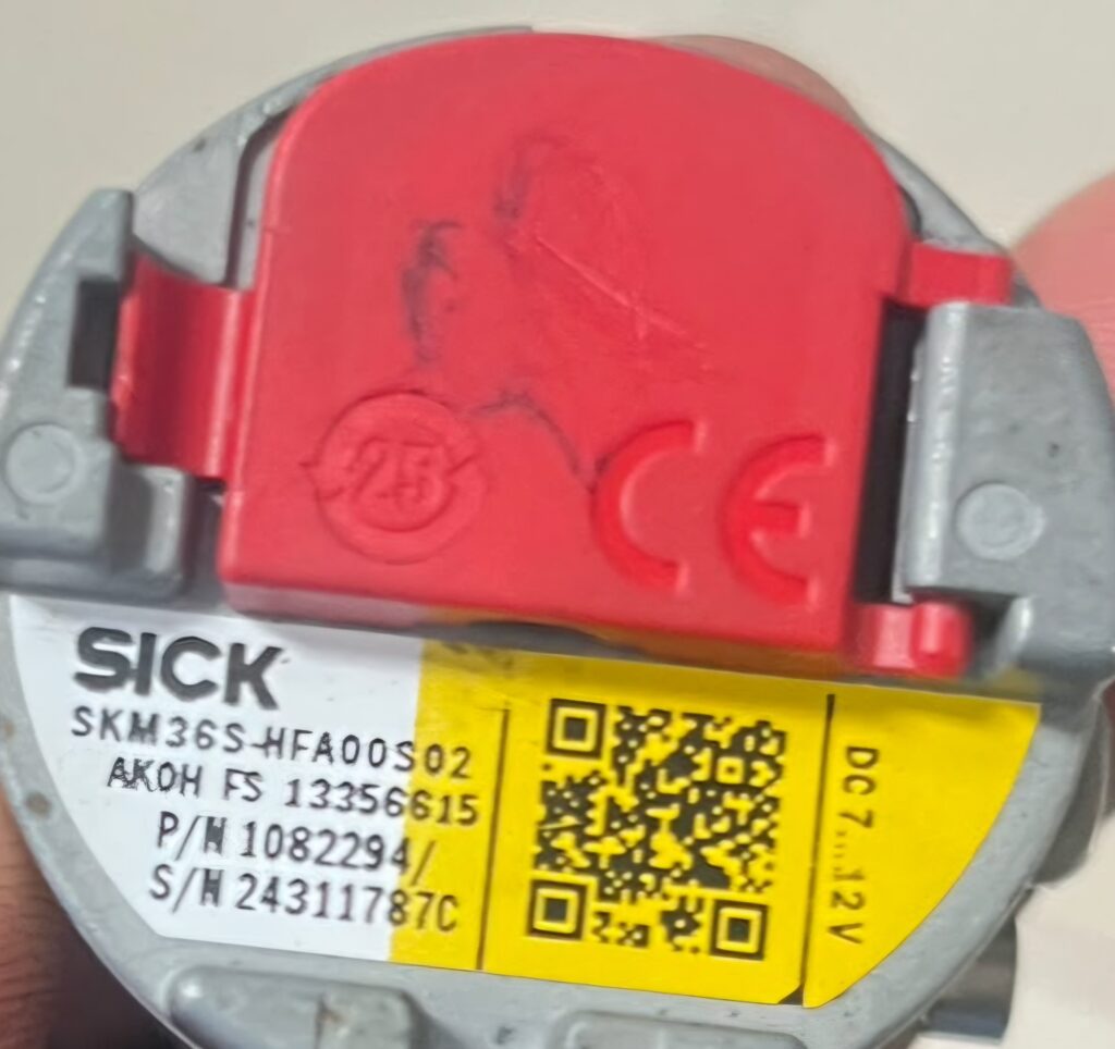 SICK motor feedback encoder with red cover and label