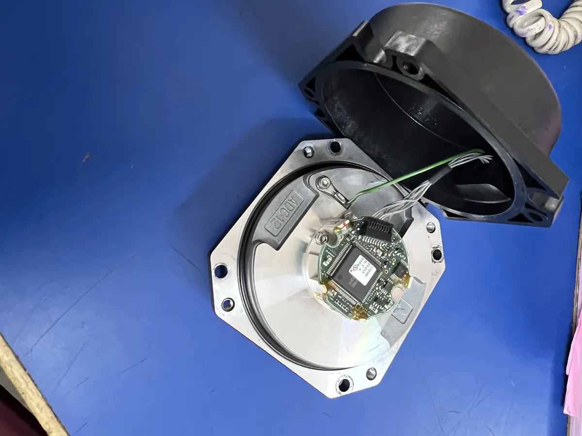 Servo motor repair in India: encoder check on an opened servo motor