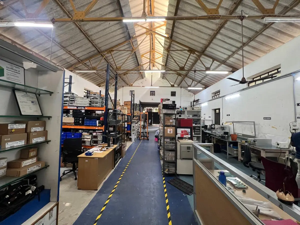 Inside the Star Automations refurbishment factory, with test benches and storage racks