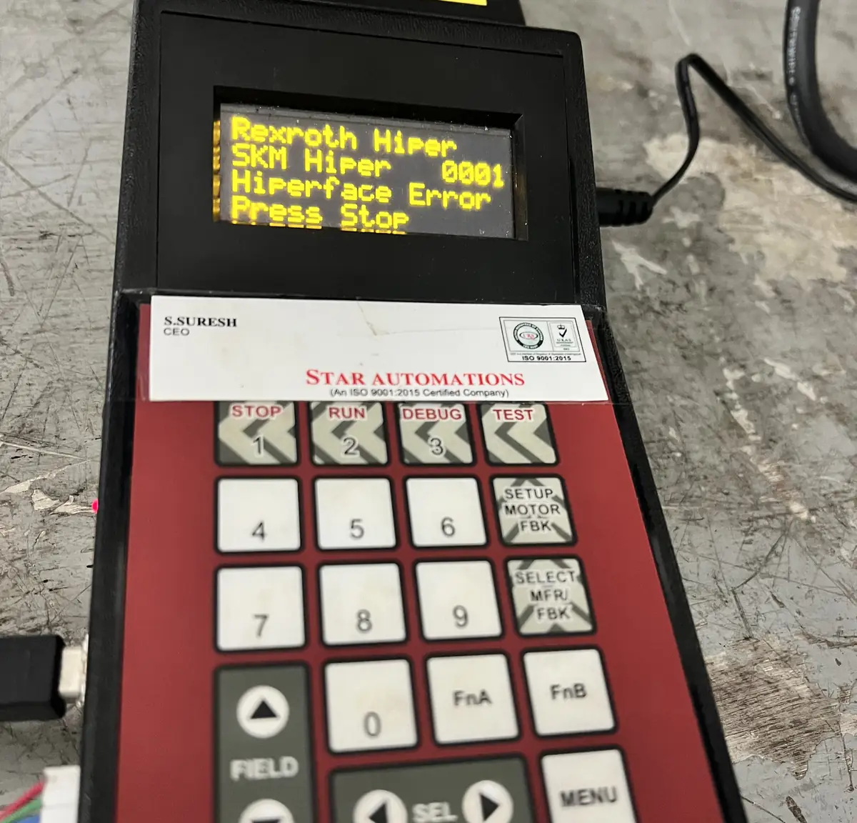 The test system's display reading a servo motor's Hiperface encoder